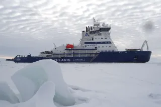 Ship in arctic conditions going through icy waters